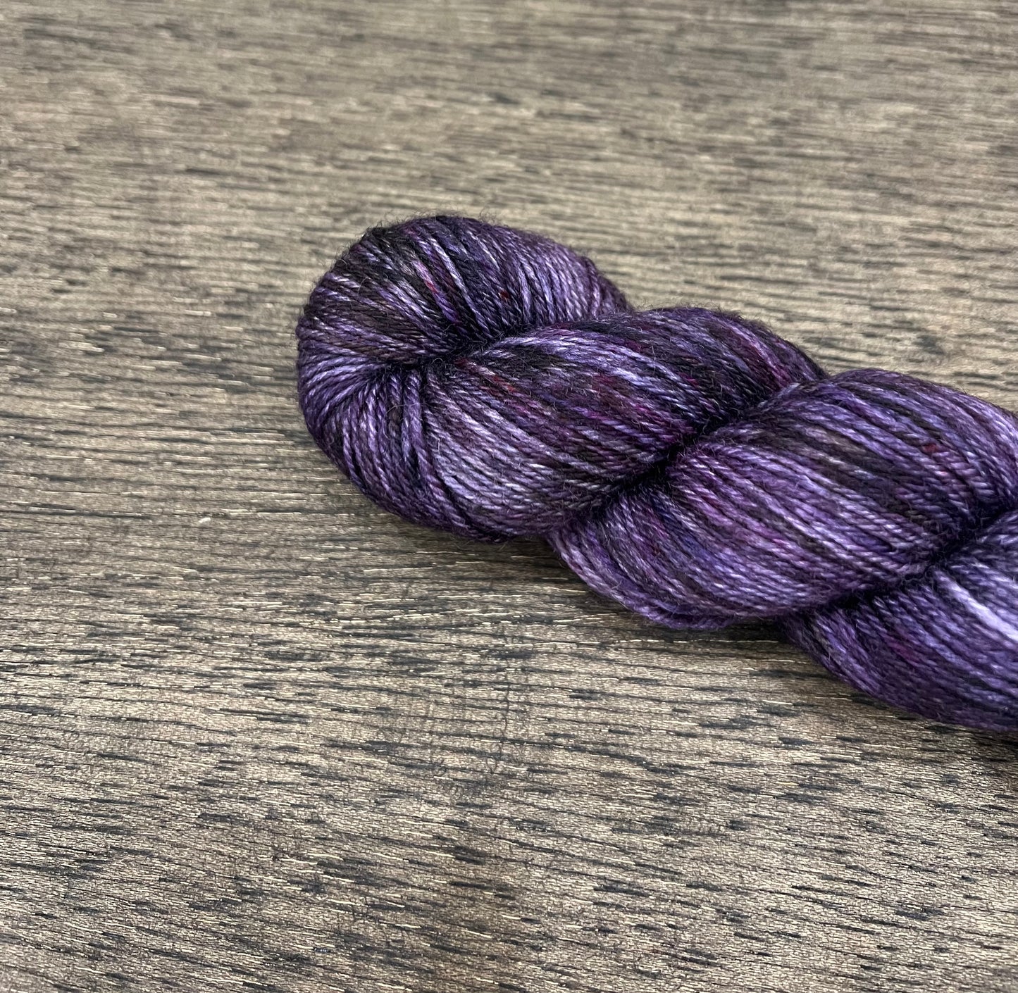 Amarantine - OOPSIE! Tonal/lightly variegated purples and black DK