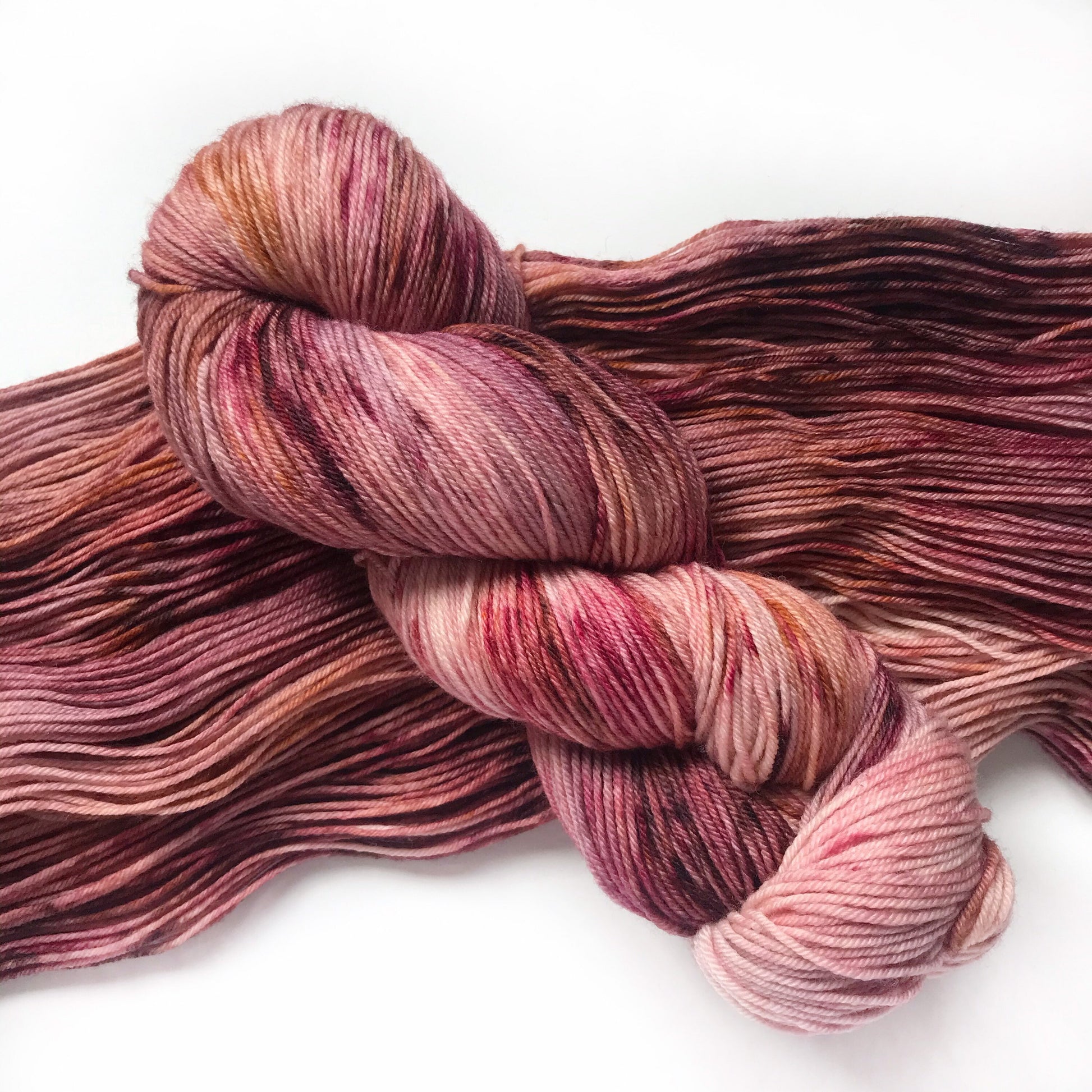 Hand Dyed Merino Wool Yarn: Pink, Copper, & Burgundy - 437m