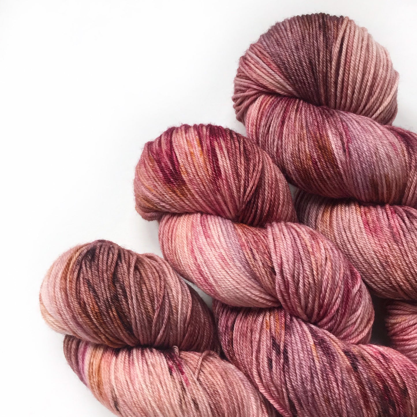 Hand Dyed Merino Wool Yarn: Pink, Copper, & Burgundy - 437m