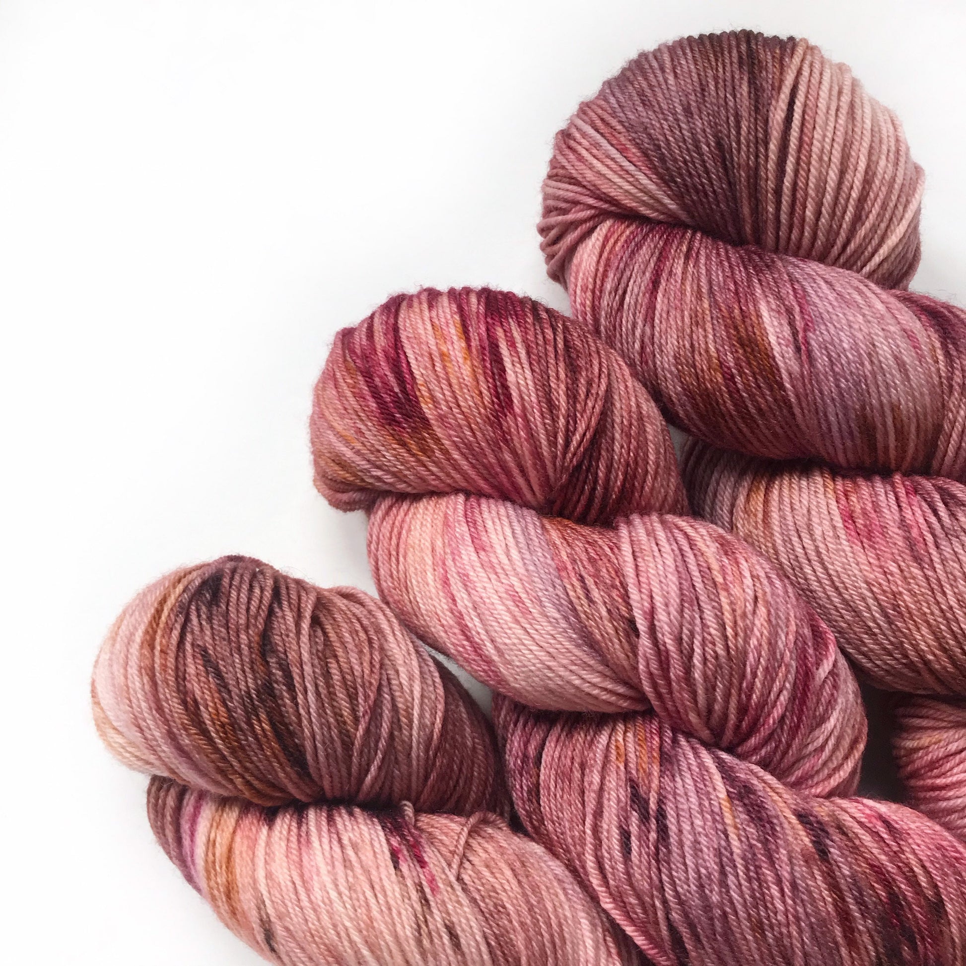 Hand Dyed Merino Wool Yarn: Pink, Copper, & Burgundy - 437m