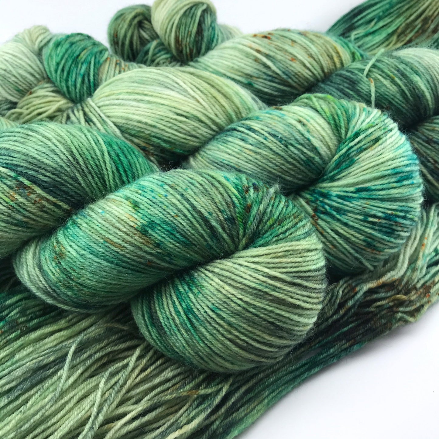 Hand Dyed Superwash Merino Sock Yarn: "WOAH, NESSIE!" Green Speckled Fingering, 437 yds