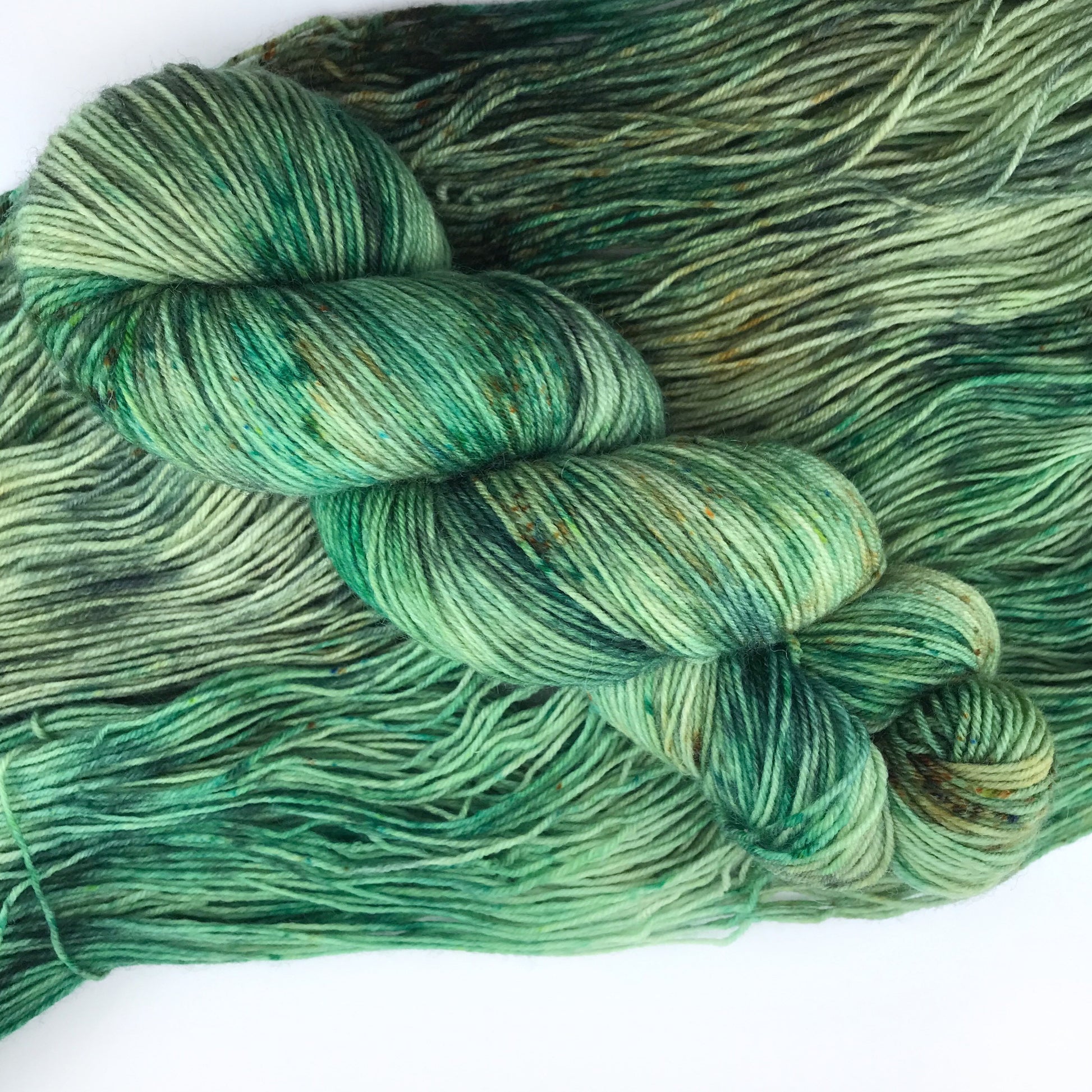 Hand Dyed Speckled Green Merino Sock Yarn: "WOAH, NESSIE!"