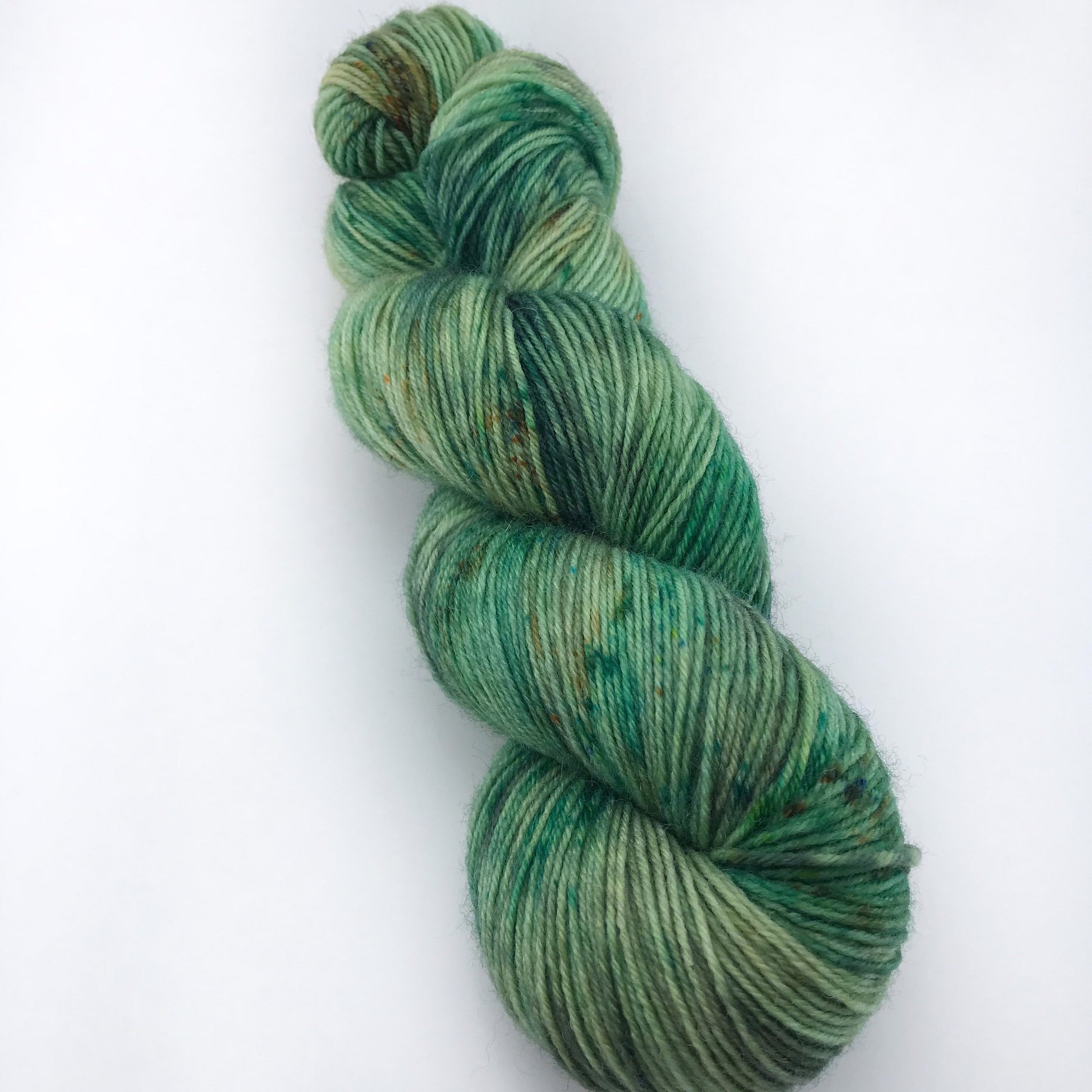 Hand Dyed Superwash Merino Sock Yarn: "WOAH, NESSIE!" Green Speckled Fingering, 437 yds