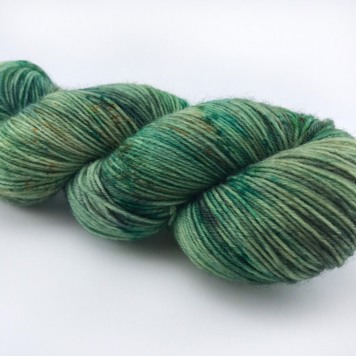 Hand Dyed Superwash Merino Sock Yarn: "WOAH, NESSIE!" Green Speckled Fingering, 437 yds